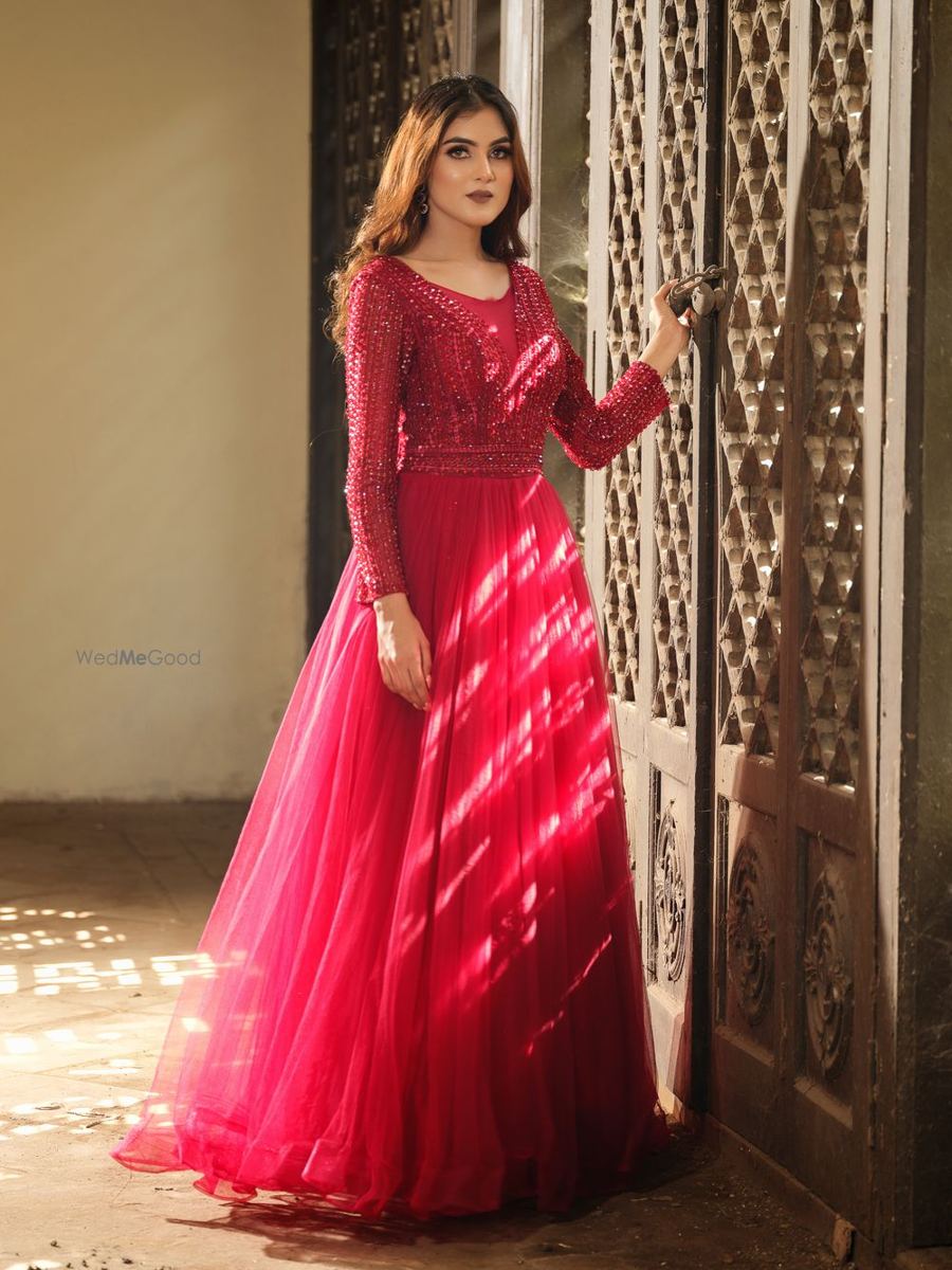 Full length red gown reception look