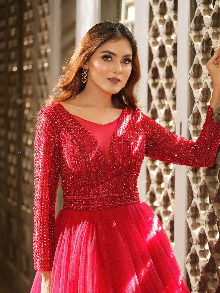 Reception look with red sequinned gown